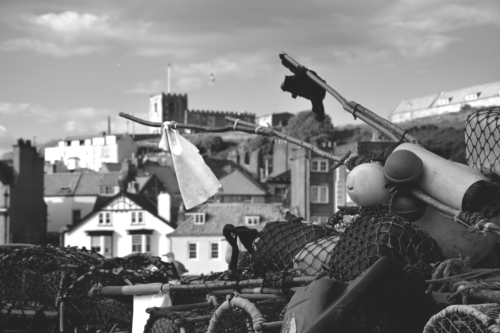 Black and white picture of fishing tackle by the bay in Whitby